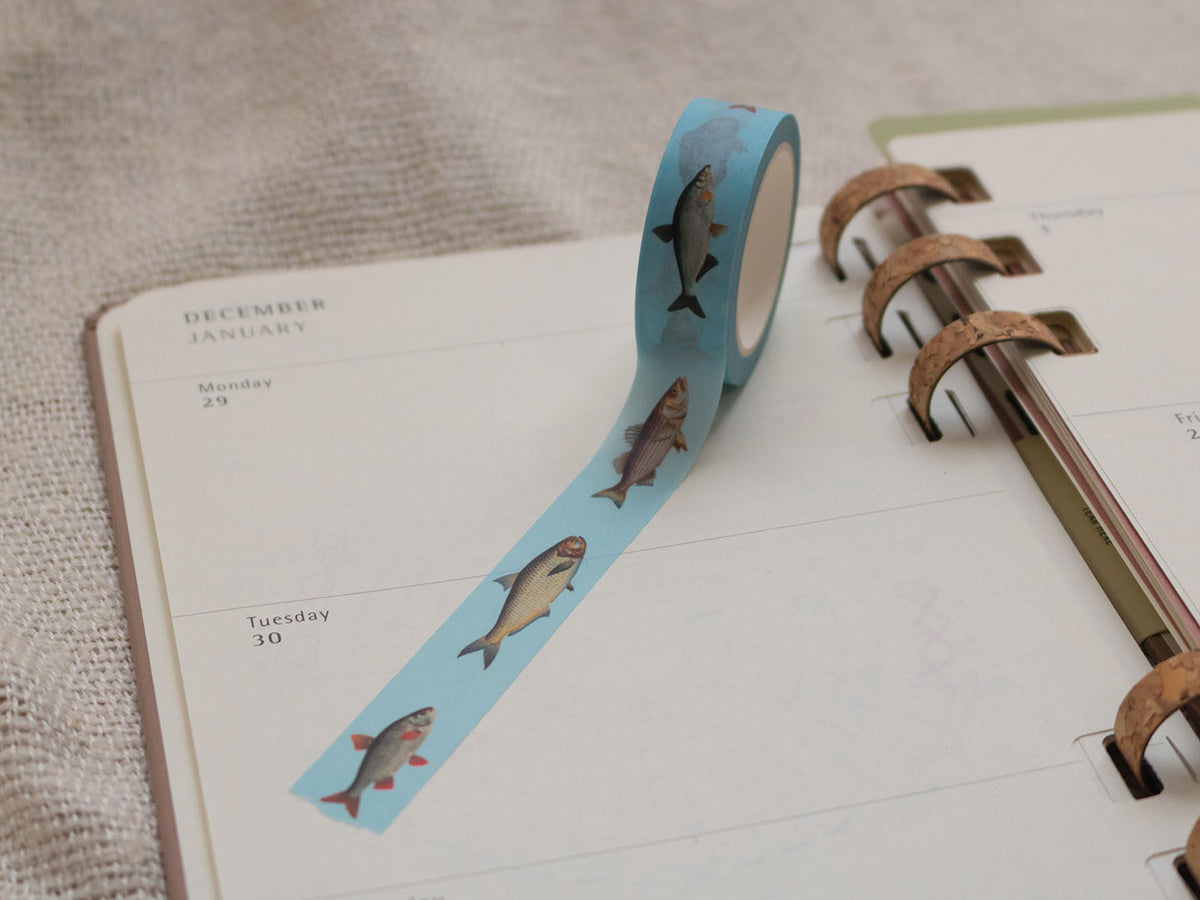 Washi tape with fish design on a planner