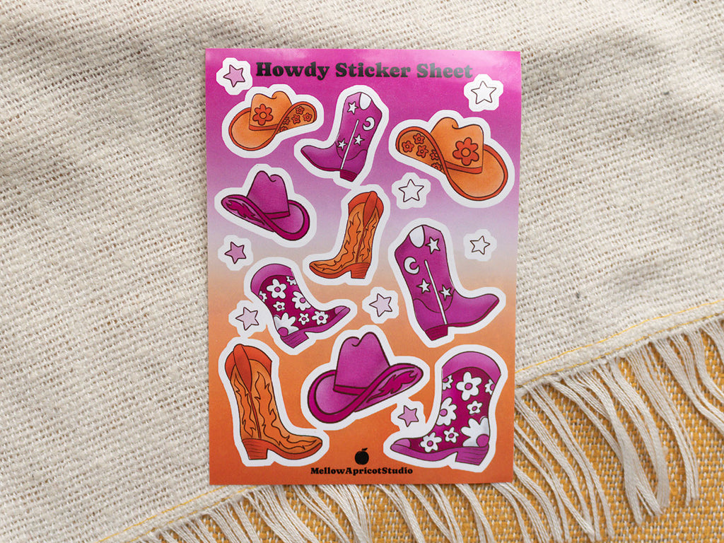 Howdy Sticker Sheet with cowboy boot and hat designs on a textured fabric background