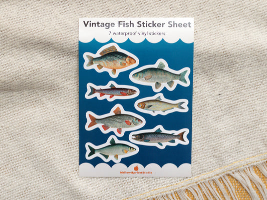 Vintage fish sticker sheet with illustrations on a textured fabric background