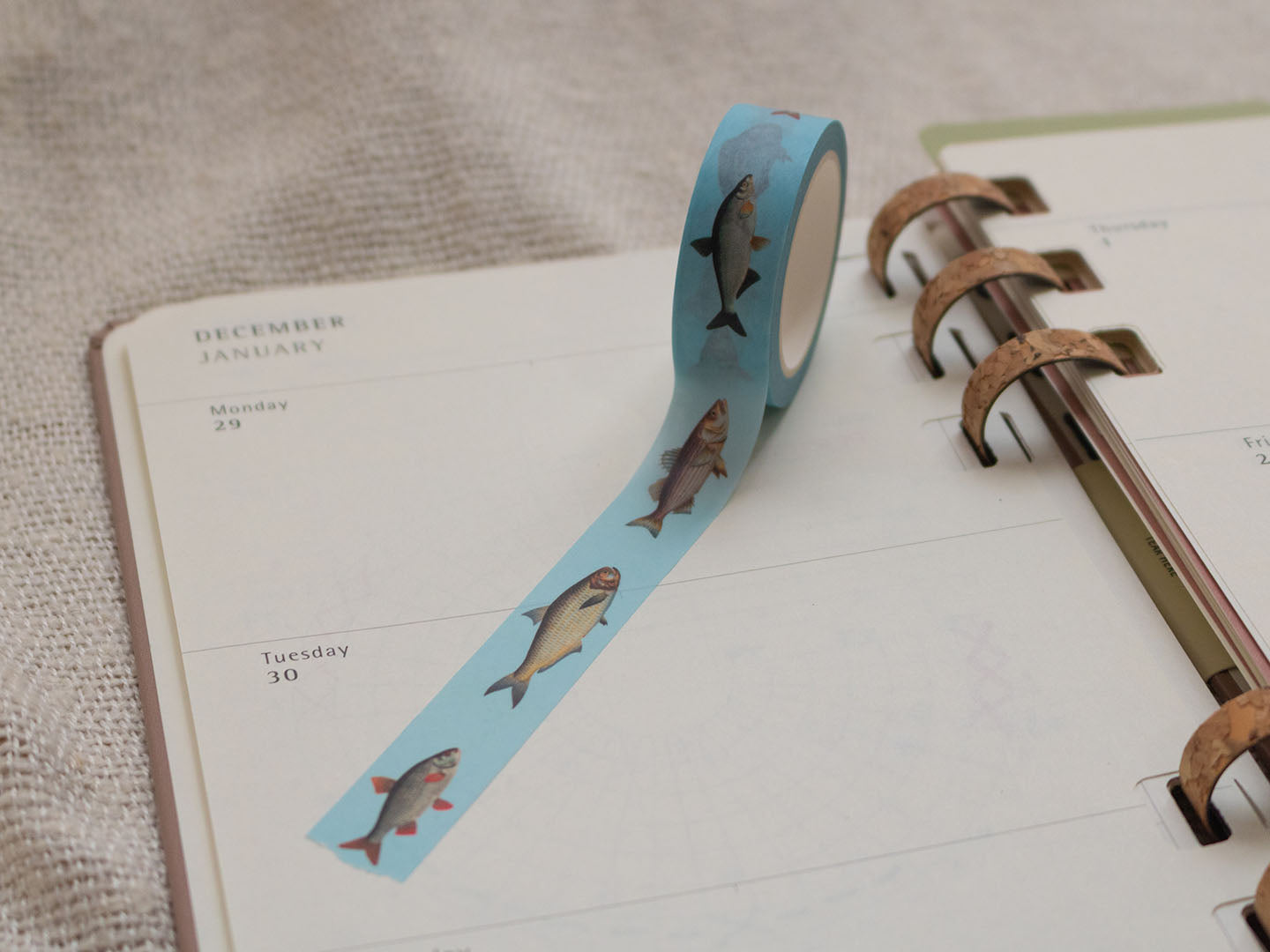 Washi tape with fish design on a planner