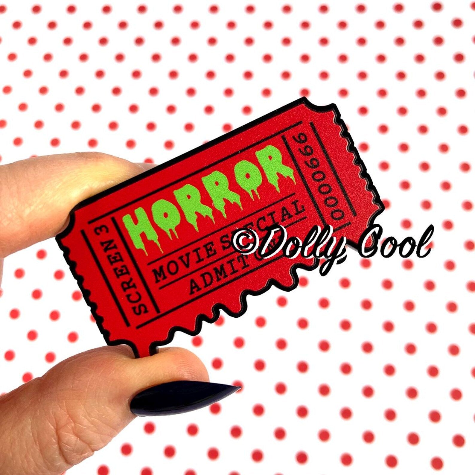 Brooch of a 50's horror movie ticket