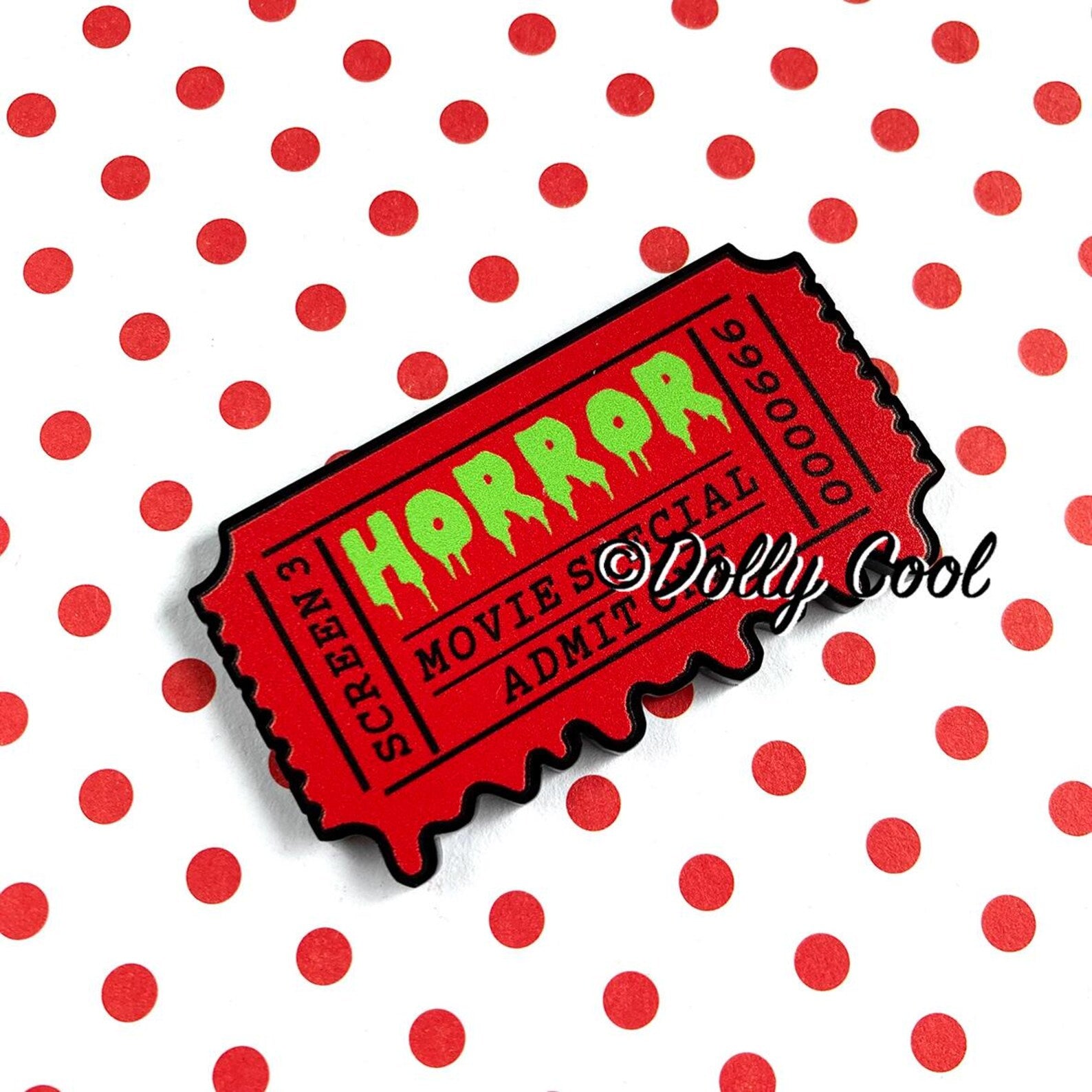 Brooch of a 50's horror movie ticket